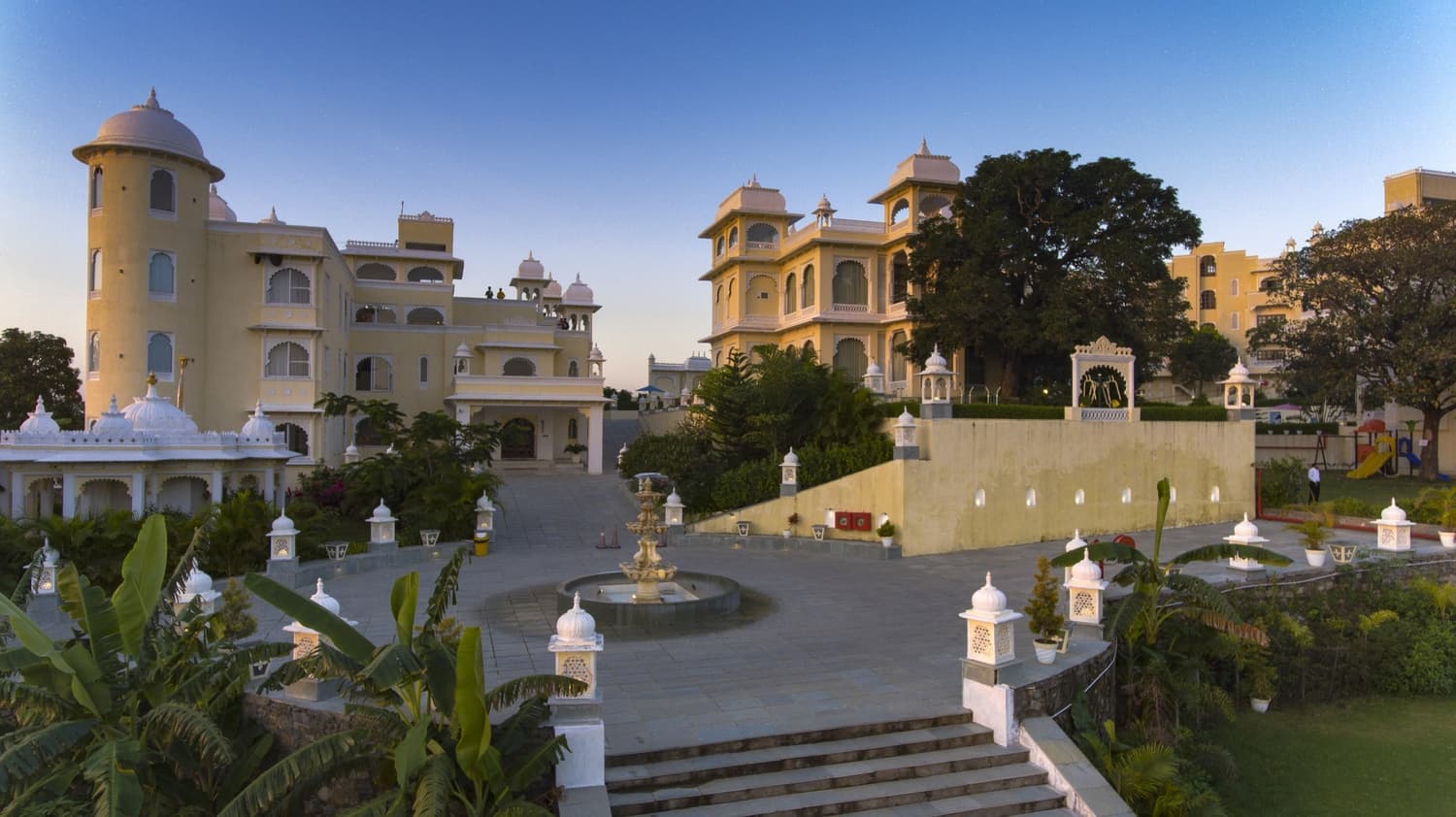 Everest Hill Resort & Spa, Kumbhalgarh: the resort's front building and fountain courtyard at dusk